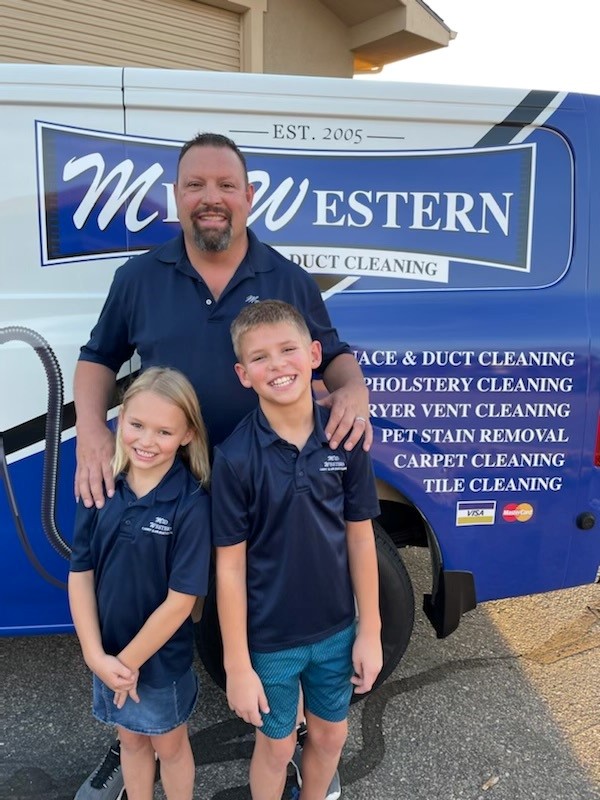 Mike Haag with Kids in front of the Midwestern Steam Clean Van